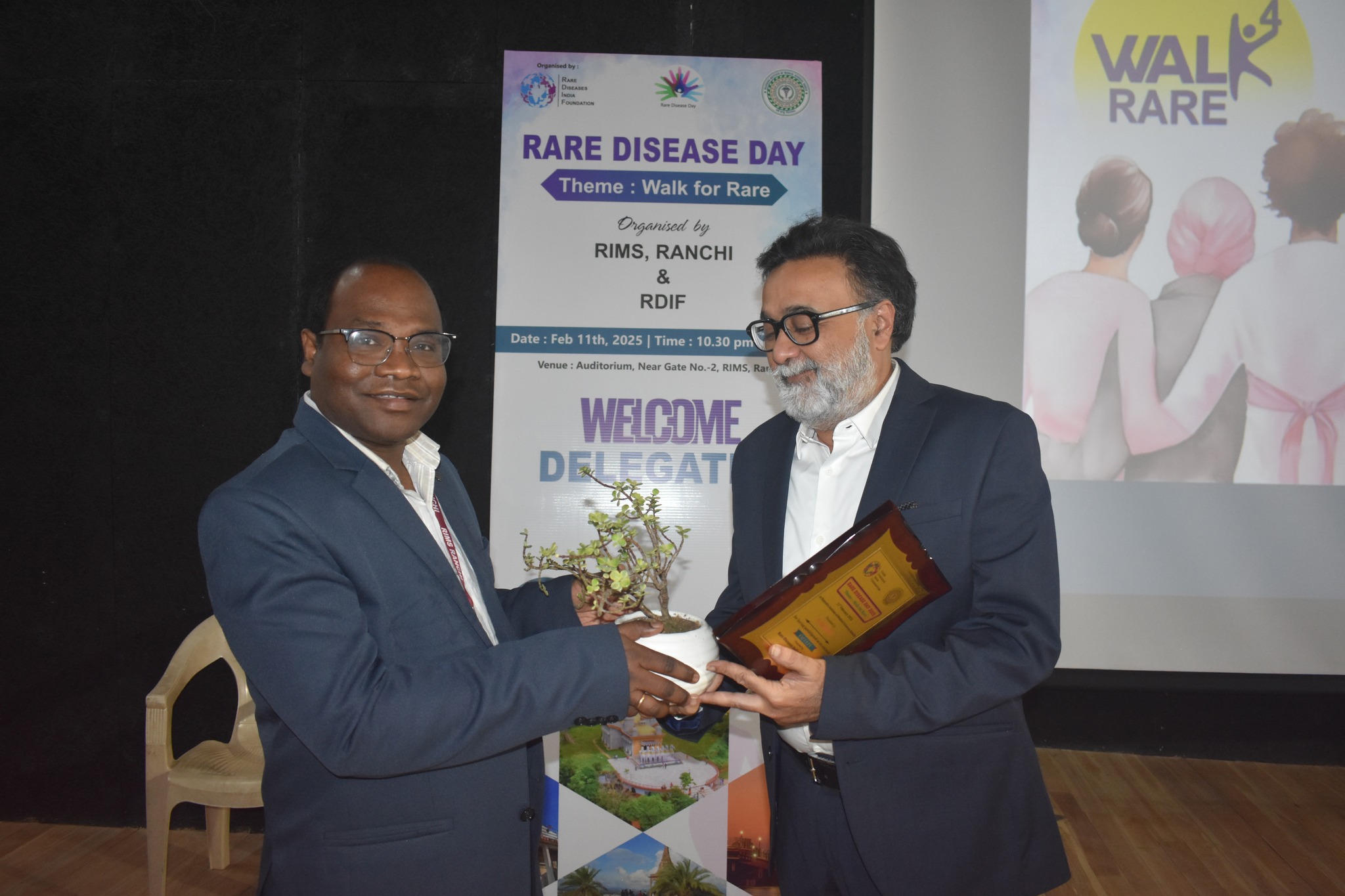 Volunteers at an informational booth during the Ranchi event.